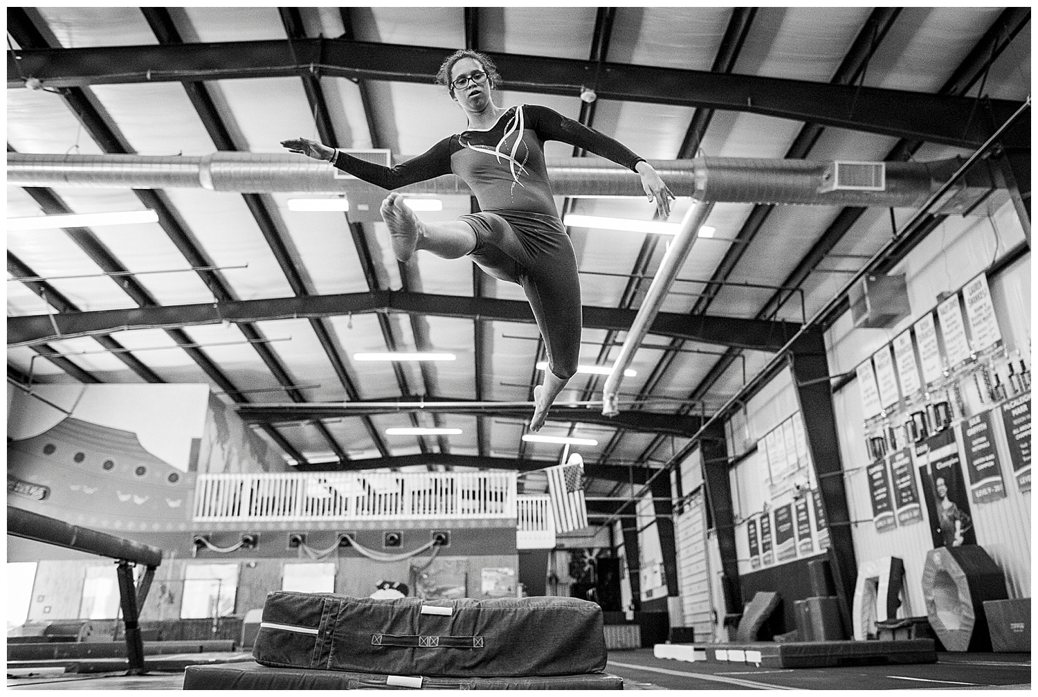 special olympics gymnast leaps through the air