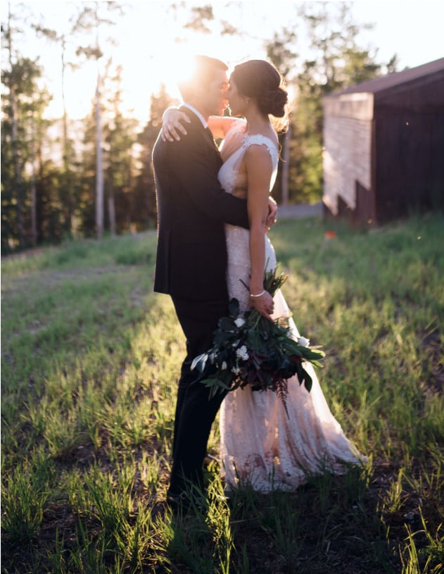 The scobey's wedding portait of bride and groom embracing 