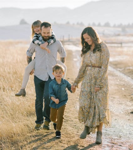 Photographer, The Scobeys and their family posing while walking 