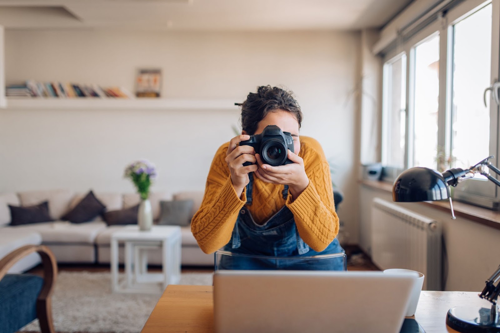 Girl taking picture with camera