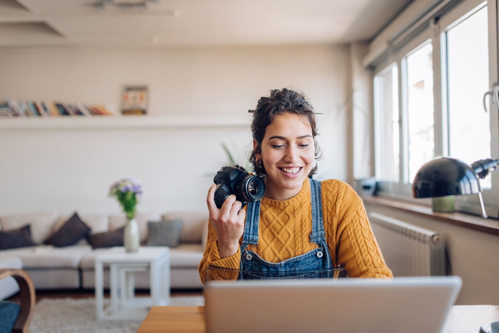 Girl with camera on laptop