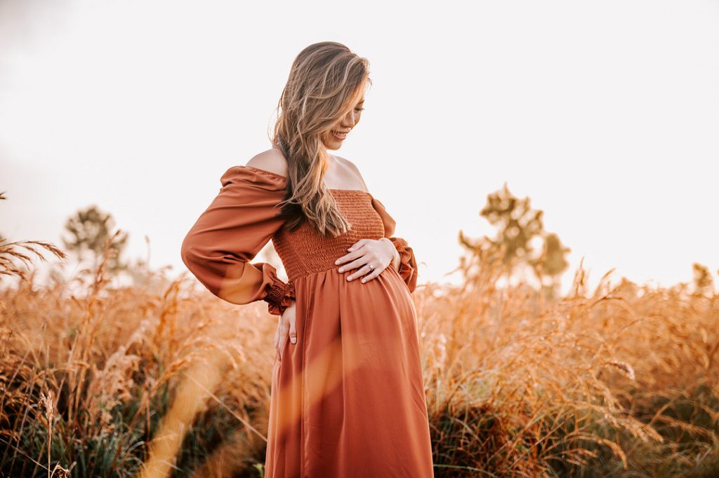 woman looking at belly