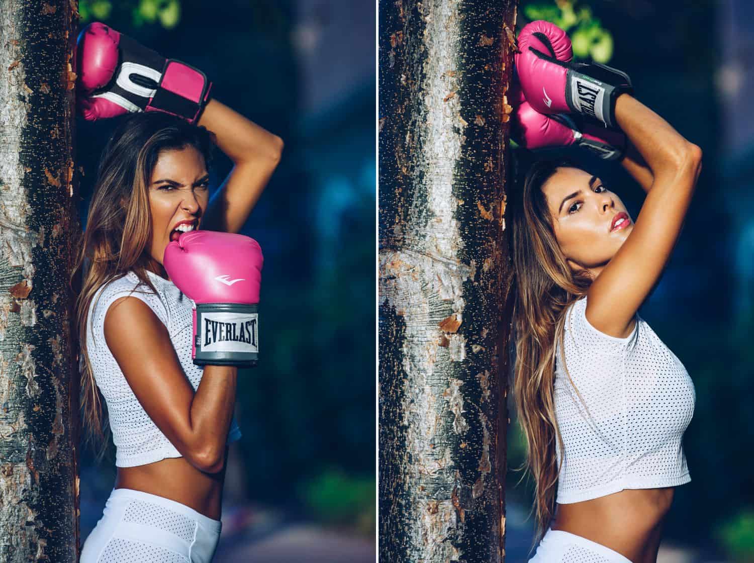 A Brazilian model wearing white workout attire poses with bright pink boxing gloves