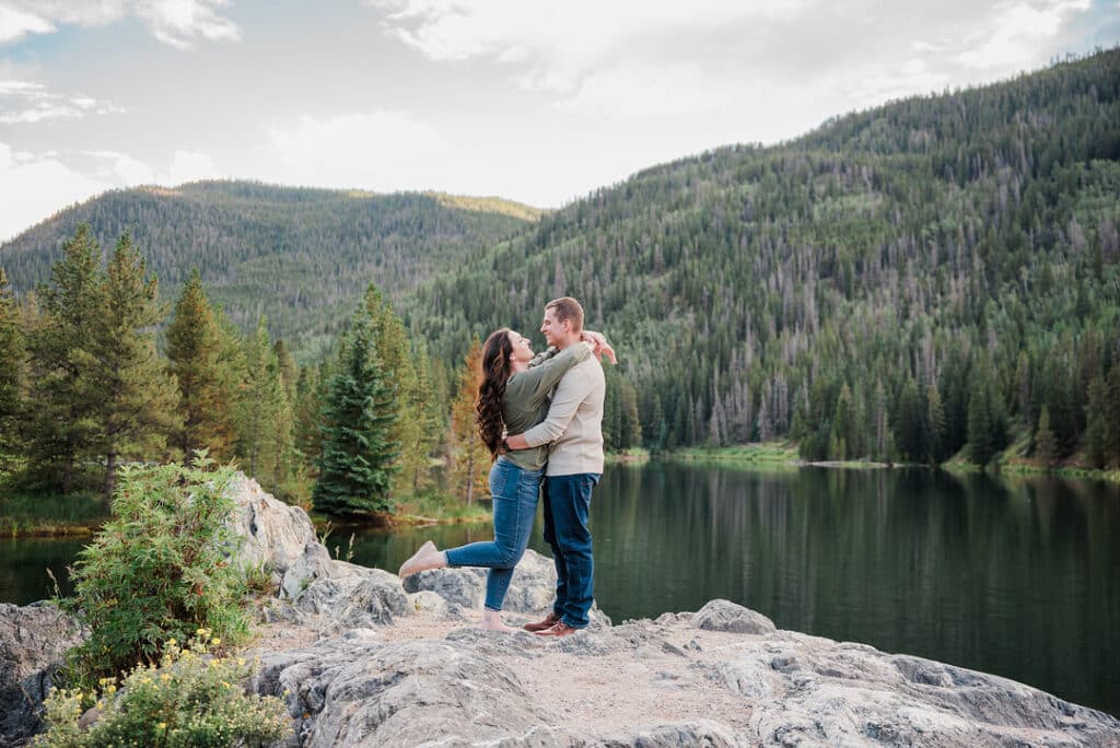 couple on rock in woods