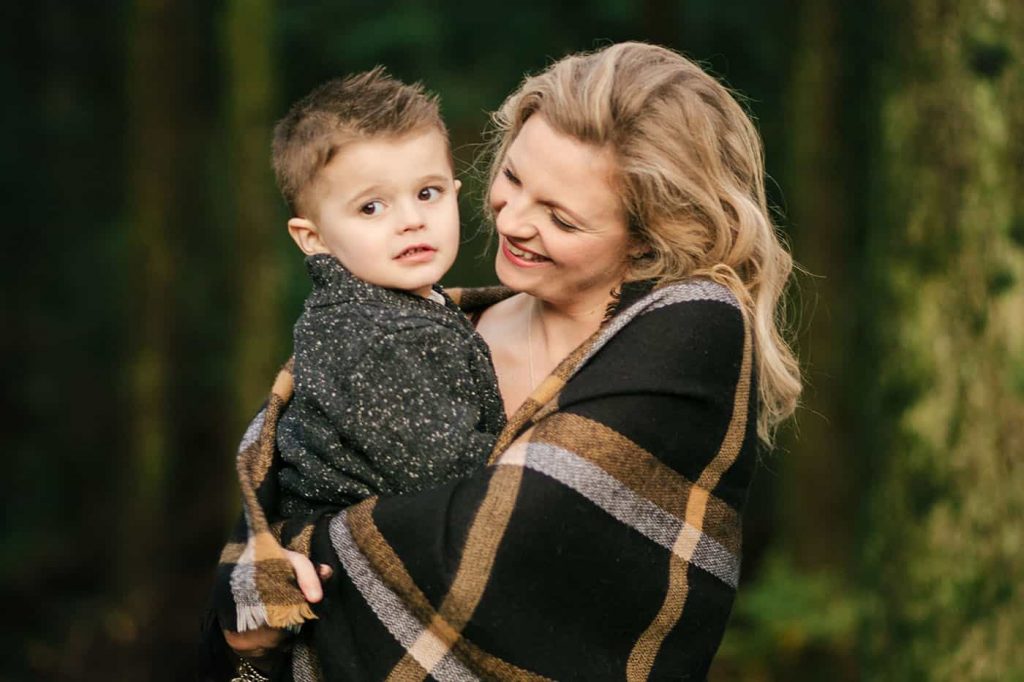 Clint Barget shoots mom and son family photo poses like this simple shot, with a mom holding her young son in her arms.