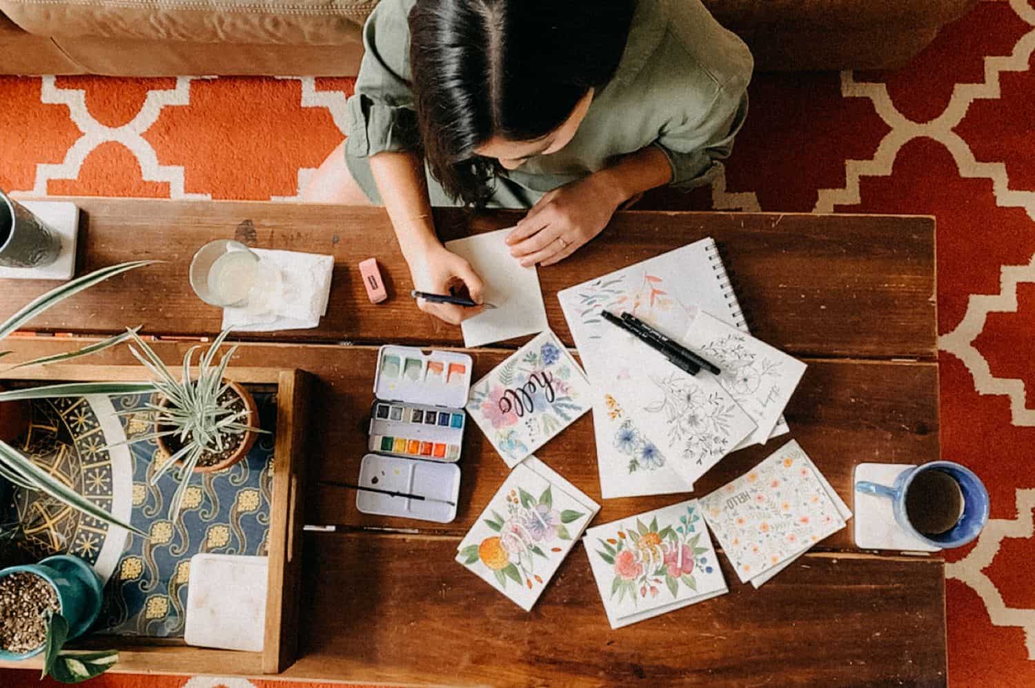 A top-down view of an artist's workspace was created via FaceTime by Barbara O. Photography