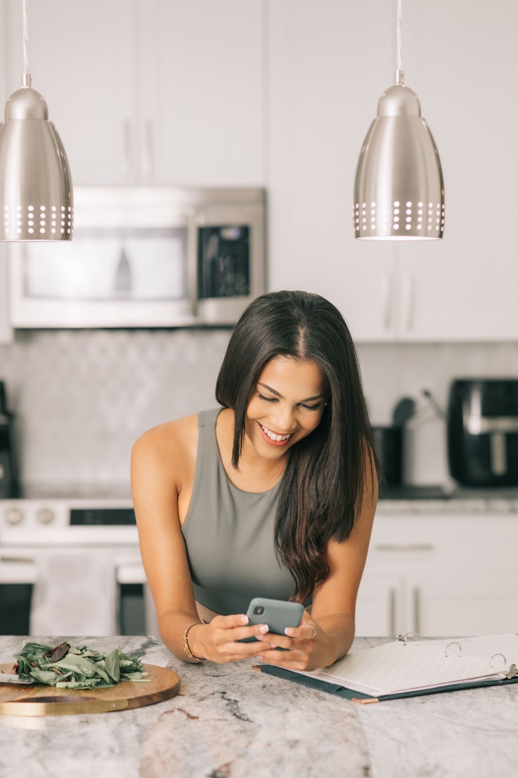 Woman smiling and on her phone