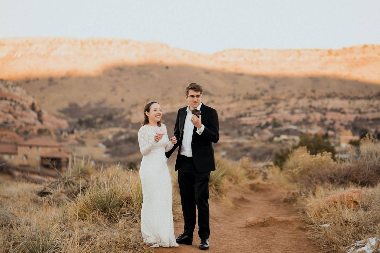 Customer Loyalty: By Nick Sparks, a bride and groom eat doughnuts in the mountains of Colorado.