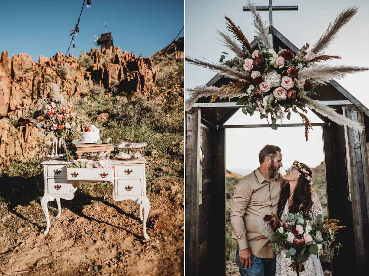 Two photographs from a desert wedding. In one, a white vintage dresser is decorated with flowers and a wedding cake, all set against the backdrop of the red mountains. In the next photo, a casually-dressed groom embraces his white-gowned bride as they stand under a tiny outdoor chapel that is decorated with flowers and a cross.