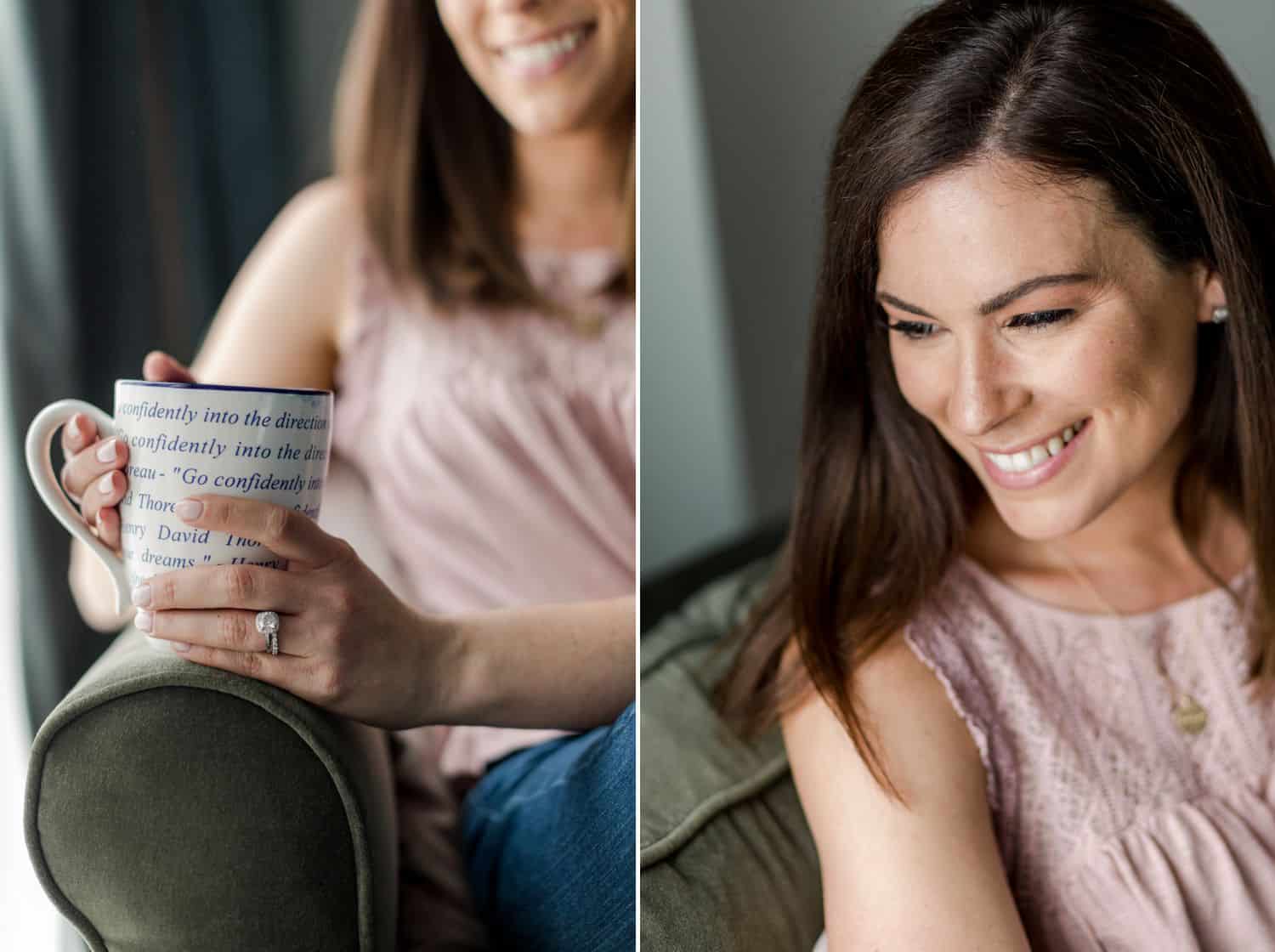 A woman in a pink shirt holds a mug of coffee while sitting in an armchair by the window.