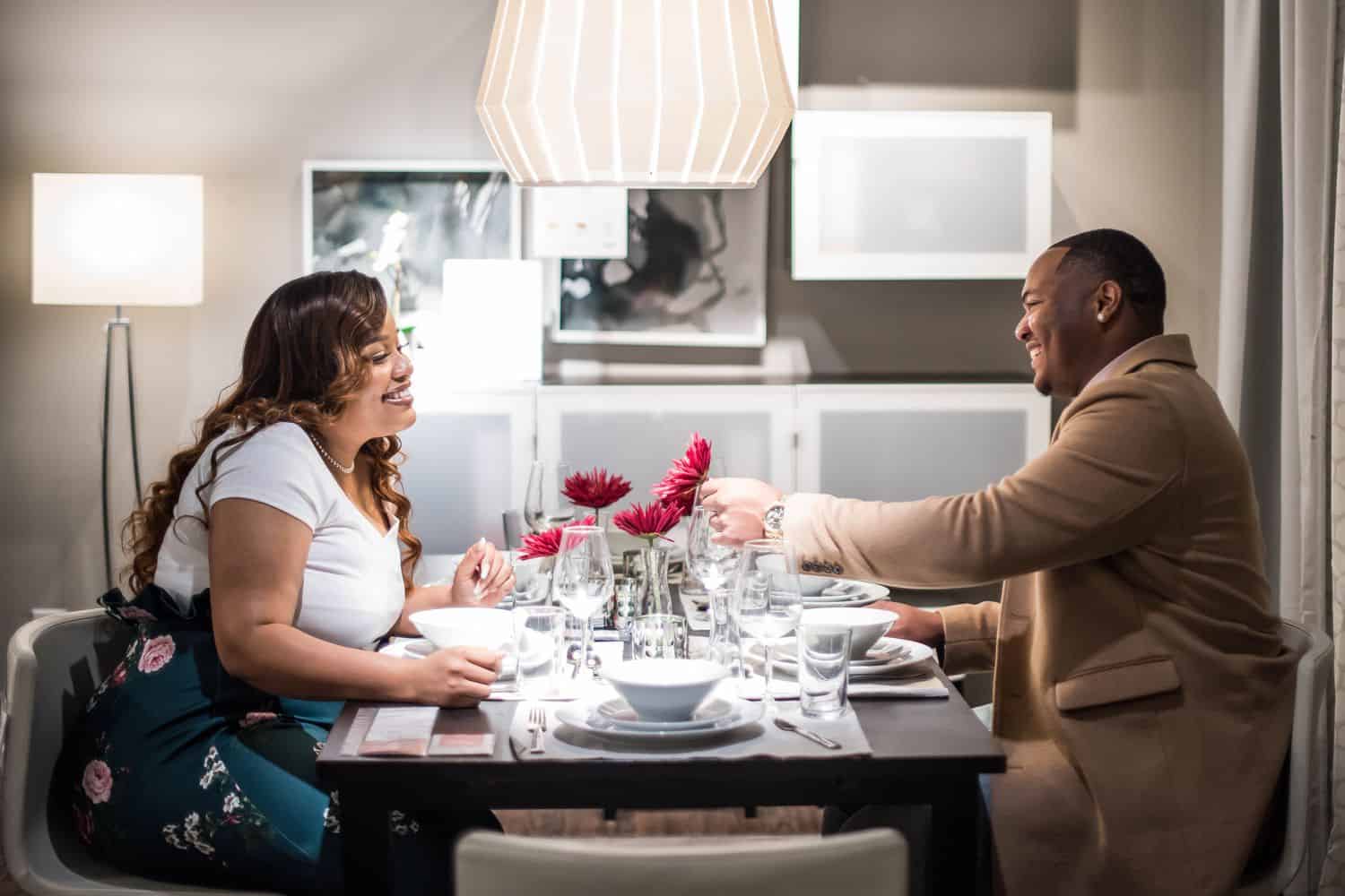 Great Engagement Sessions: Couple sits in an IKEA dining room.