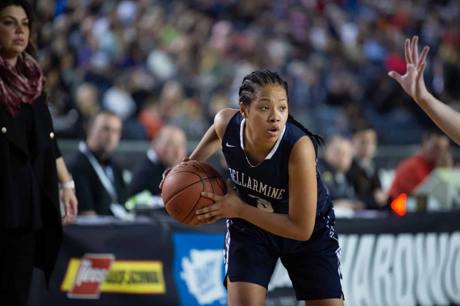 a girls high school basketball player dashed across the court with the ball