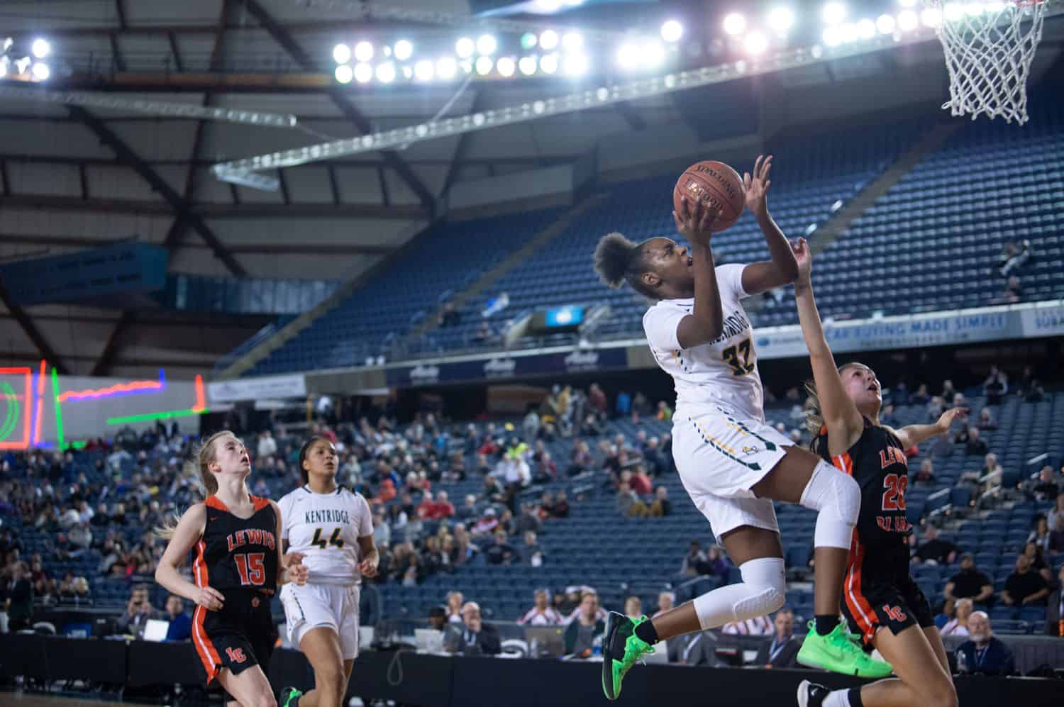 a high school girls basketball team plays aggressively