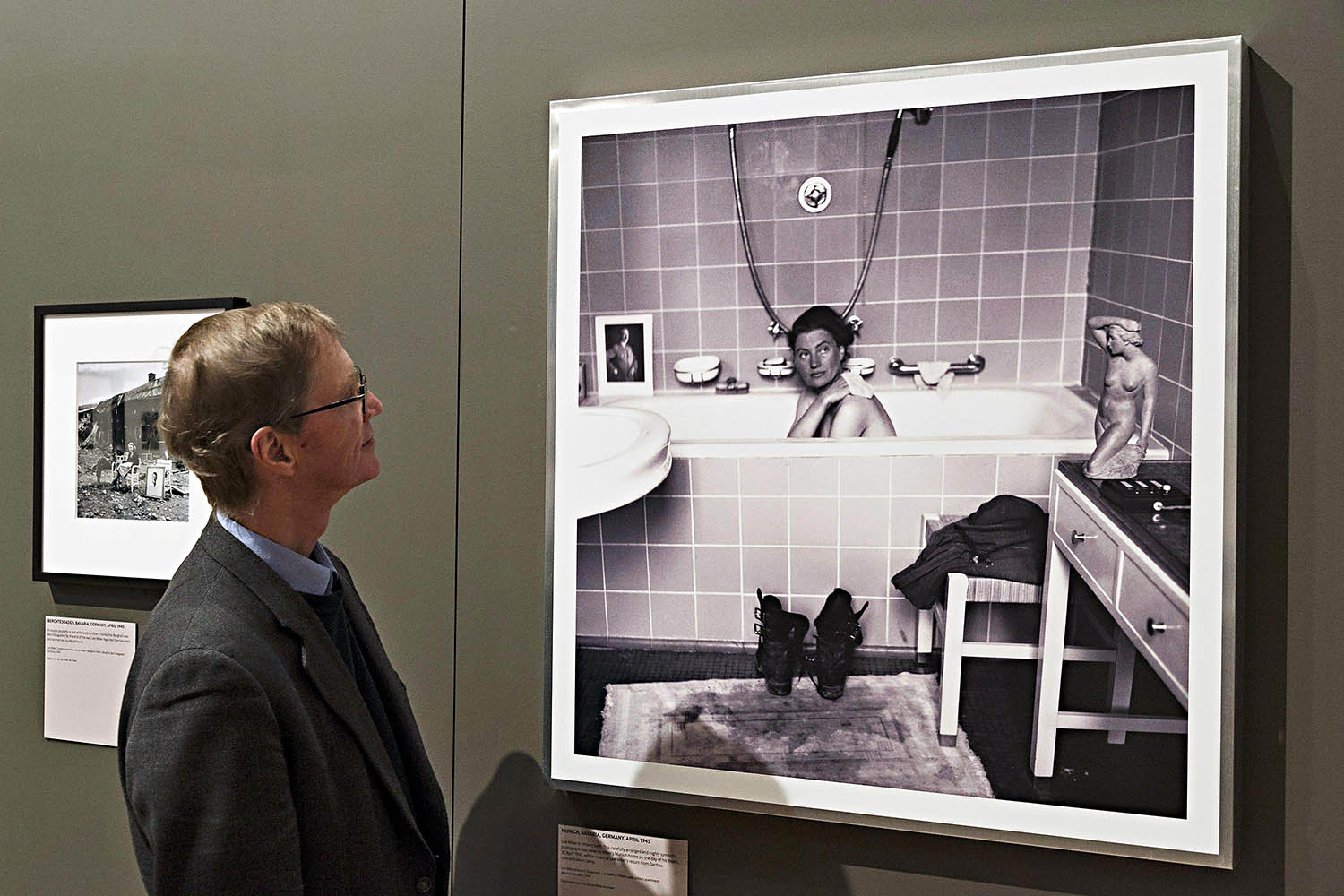 A framed print of David E. Scherman's portrait of photojournalist Lee Miller in Adolf Hitler's bathtub after a disturbing visit to the Dachau concentration camp.