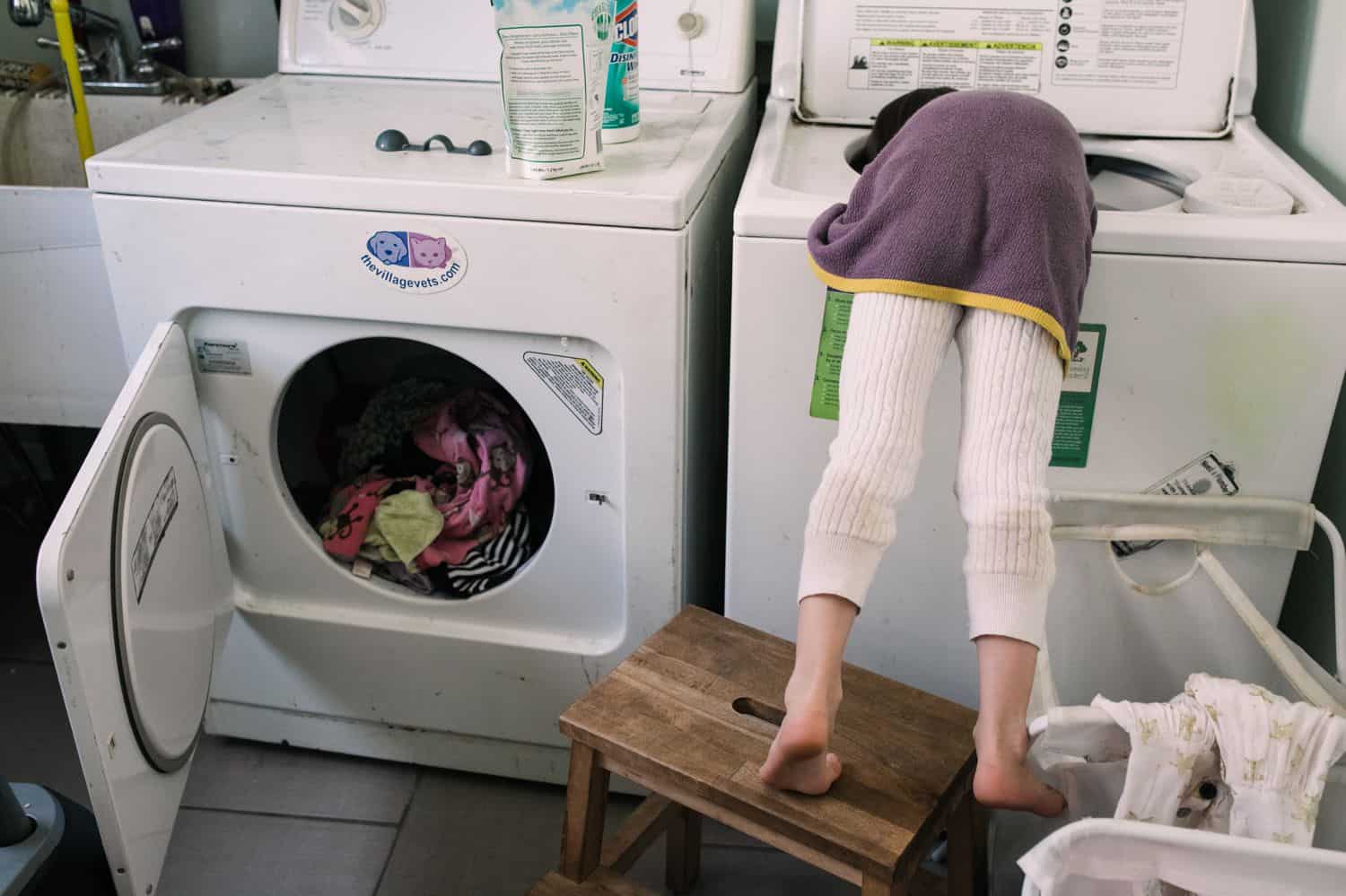 Fearless Family Photos All Have These 4 Ingredients: Lifestyle Photography - Little Girl Doing Laundry