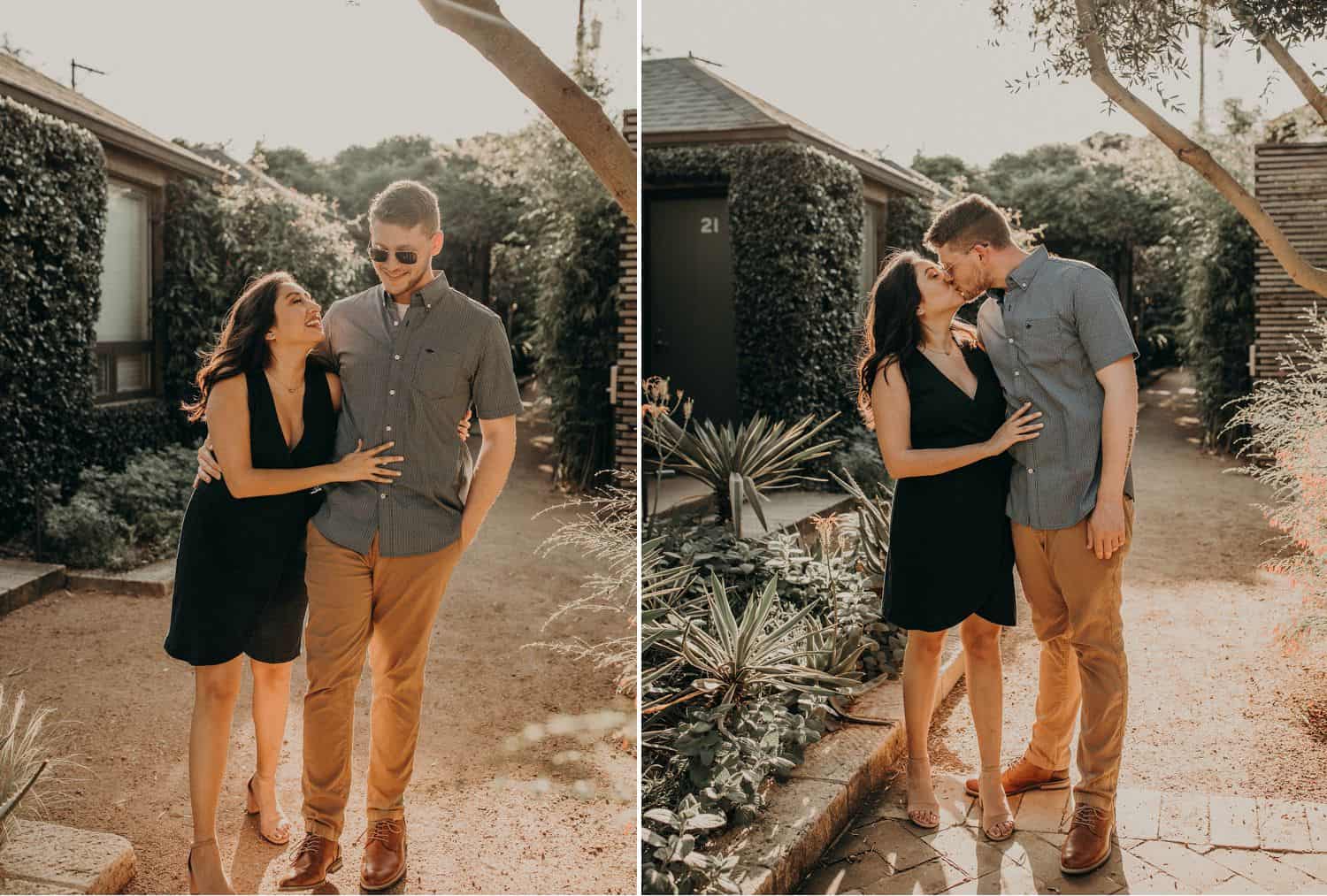 A man and a woman stroll and kiss with the sun shining bright behind them