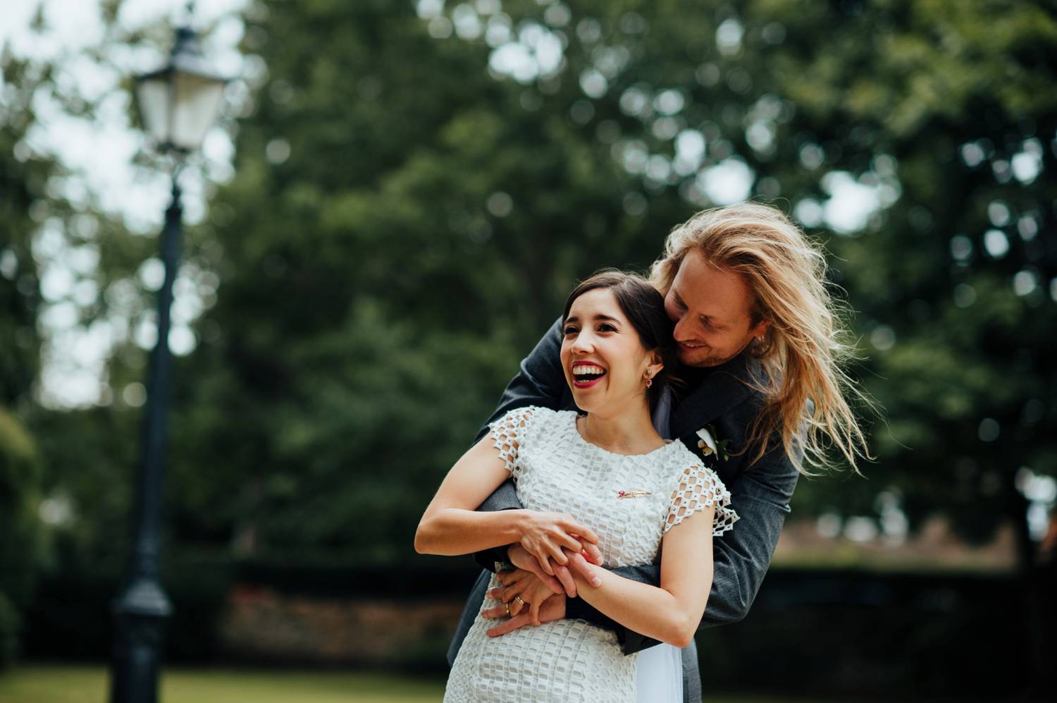 bride and groom hugging